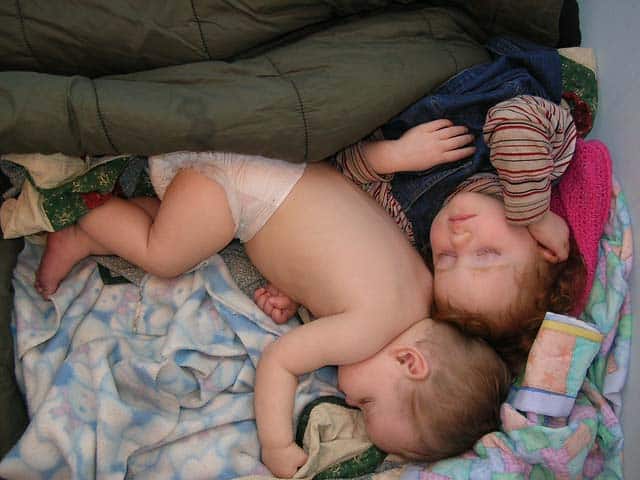 babies sleeping in a tent